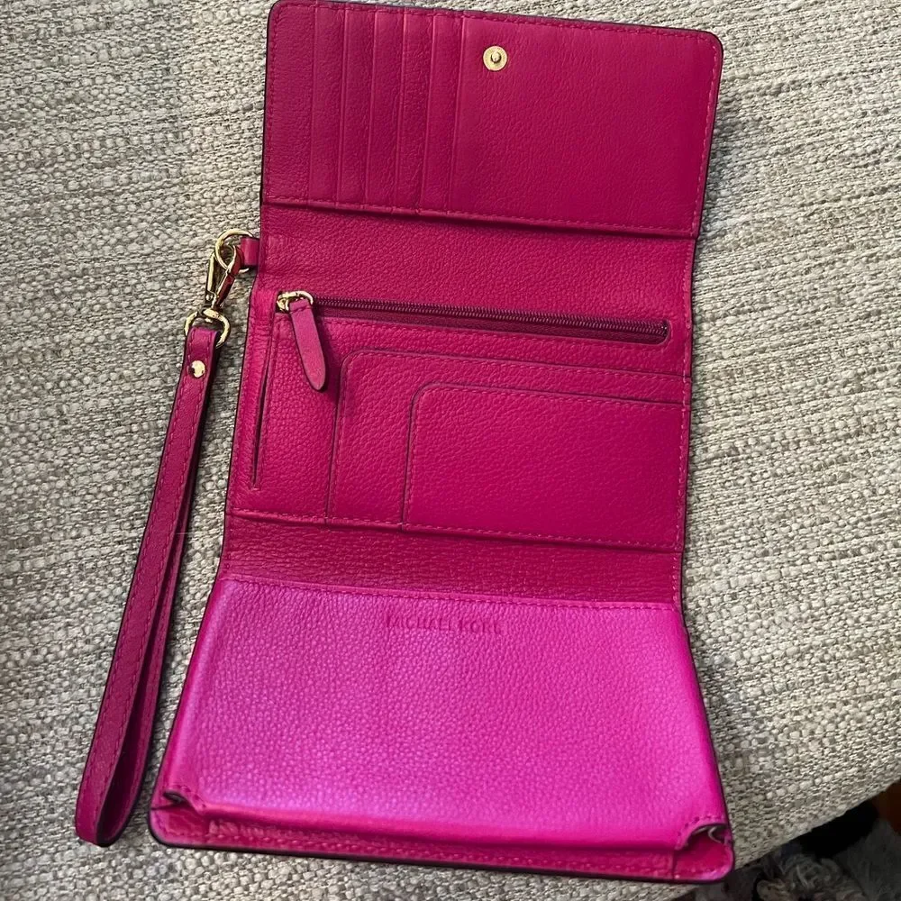 Michael Kors fuchsia multi function wristlet